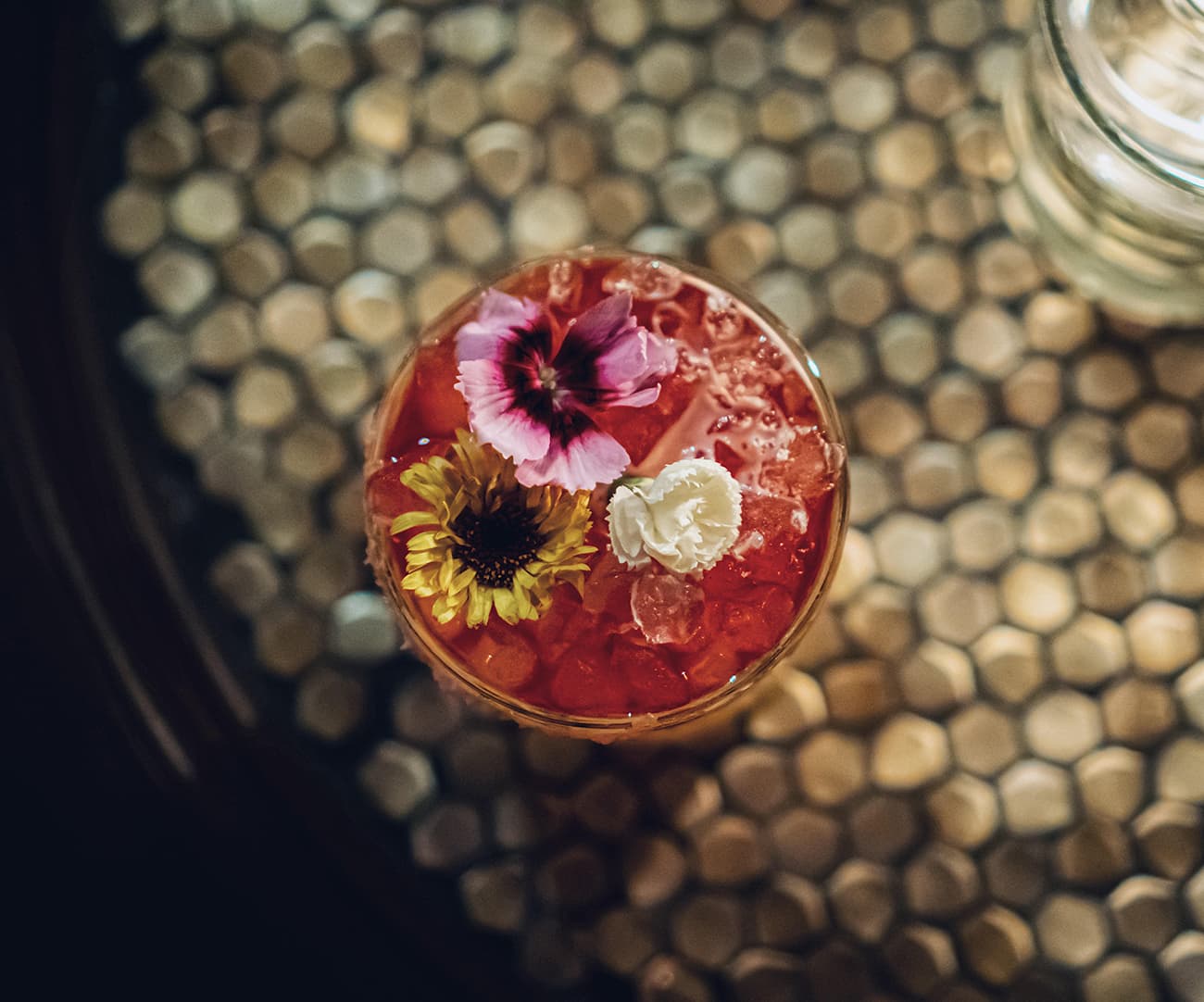 A signature cocktail at Oculto 477 in low light